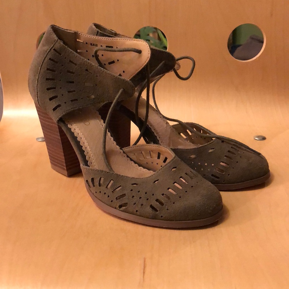Restricted cut-out/lace up block heels.